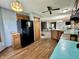 Kitchen featuring wood cabinets, a black refrigerator, and wood flooring at 741 Springmill Dr, Mooresville, IN 46158