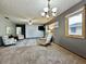 Living room with a carpeted floor and two sitting areas at 741 Springmill Dr, Mooresville, IN 46158