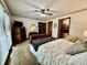 Comfortable main bedroom featuring a ceiling fan, TV, carpet floors, and lots of natural light at 741 Springmill Dr, Mooresville, IN 46158