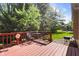 Outdoor area featuring a red back deck with natural trees at 742 Marana Dr, Carmel, IN 46032