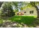 Large backyard with mature trees and a red deck at 742 Marana Dr, Carmel, IN 46032