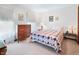 Bright bedroom with neutral walls, a quilt-covered bed, and natural light at 742 Marana Dr, Carmel, IN 46032