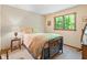 Cozy bedroom featuring natural light from the window and classic decor at 742 Marana Dr, Carmel, IN 46032