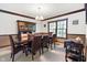 Traditional dining room featuring wood table, upholstered chairs, and a dark wood china cabinet at 742 Marana Dr, Carmel, IN 46032