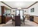 Formal dining room showcasing hardwood trim, a china cabinet, and a classic chandelier at 742 Marana Dr, Carmel, IN 46032