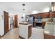 Open kitchen with stainless appliances, granite countertops, and tile floors at 742 Marana Dr, Carmel, IN 46032