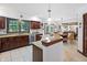 Open kitchen with stainless appliances, granite countertops, and breakfast bar seating at 742 Marana Dr, Carmel, IN 46032