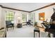 Bright living room with hardwood floors, a piano, and comfortable seating at 742 Marana Dr, Carmel, IN 46032