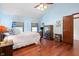 Spacious main bedroom with hardwood floors, high ceilings, and a view to the outside at 742 Marana Dr, Carmel, IN 46032