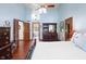 Main bedroom with hardwood floors, a ceiling fan, and ensuite bathroom at 742 Marana Dr, Carmel, IN 46032
