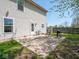 Home's backyard featuring a patio, grill, and easy access to the upper-level interior of the home at 7611 Penguin Cir, Indianapolis, IN 46239