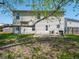 View of the home's backyard featuring a patio, grill, and swing at 7611 Penguin Cir, Indianapolis, IN 46239
