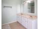Bathroom vanity with dual sinks and modern fixtures at 7611 Penguin Cir, Indianapolis, IN 46239