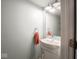 Compact bathroom with a modern sink and a towel holder at 7611 Penguin Cir, Indianapolis, IN 46239