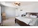Comfortable bedroom with a ceiling fan, neutral colors, and plenty of natural light at 7611 Penguin Cir, Indianapolis, IN 46239