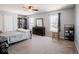 Cozy bedroom with a ceiling fan, carpet, and a closet, offering a peaceful retreat at 7611 Penguin Cir, Indianapolis, IN 46239