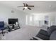 Bonus room with television, and comfortable seating at 7611 Penguin Cir, Indianapolis, IN 46239
