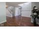 Inviting foyer with hardwood floors, staircase, and neutral tones at 7611 Penguin Cir, Indianapolis, IN 46239