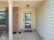 Front door with a storm door, and brick accents at 7611 Penguin Cir, Indianapolis, IN 46239