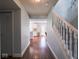 Hallway leading into an eat-in kitchen with a staircase to the right at 7611 Penguin Cir, Indianapolis, IN 46239