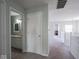 Upstairs hallway connecting bedrooms and a bathroom at 7611 Penguin Cir, Indianapolis, IN 46239