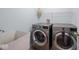 Convenient laundry room with modern washer and dryer units, offering practicality and functionality at 7611 Penguin Cir, Indianapolis, IN 46239