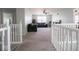 Upstairs living area with comfortable seating, a ceiling fan, and natural light, ideal for relaxation at 7611 Penguin Cir, Indianapolis, IN 46239