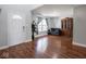 Spacious living room with hardwood floors, a hutch, and neutral paint at 7611 Penguin Cir, Indianapolis, IN 46239