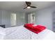 Comfortable main bedroom featuring carpeting, natural light, and ensuite bathroom at 7611 Penguin Cir, Indianapolis, IN 46239
