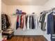 Spacious walk-in closet with wooden floors and ample storage space at 7611 Penguin Cir, Indianapolis, IN 46239