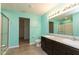 Bright bathroom with a double vanity and walk-in shower and tile floors at 7643 Belmac Ln, Camby, IN 46113