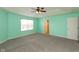 Bedroom features carpet flooring, a ceiling fan, and an open ensuite at 7643 Belmac Ln, Camby, IN 46113