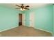 Bedroom features carpet flooring, a ceiling fan, and a open closet door at 7643 Belmac Ln, Camby, IN 46113