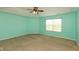 Bedroom features carpet flooring, a ceiling fan, and a window with natural light at 7643 Belmac Ln, Camby, IN 46113