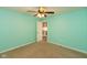Bedroom features carpet flooring, a ceiling fan, and a open closet at 7643 Belmac Ln, Camby, IN 46113