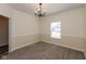 Bright, carpeted dining room with neutral walls and a window, perfect for Gathering meals at 7643 Belmac Ln, Camby, IN 46113