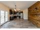 Stylish kitchen featuring dark cabinets, stainless steel appliances, and a wood-look floor at 7643 Belmac Ln, Camby, IN 46113