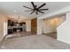 Open-concept living room with modern finishes and stainless steel appliances in the kitchen at 7643 Belmac Ln, Camby, IN 46113