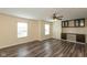 Bright living room with hardwood floors, built in cabinets, and lots of natural light at 7643 Belmac Ln, Camby, IN 46113