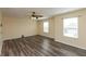 Bright living room with hardwood floors, modern lighting, and lots of natural light at 7643 Belmac Ln, Camby, IN 46113