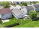 An aerial view of a home's fenced backyard with a patio and green space at 8141 Maple Stream Ln, Indianapolis, IN 46217