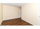 Bedroom featuring hardwood floors, neutral walls, and white painted trim at 8141 Maple Stream Ln, Indianapolis, IN 46217
