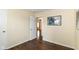 Cozy bedroom featuring neutral walls, hardwood floors and open door to the home at 8141 Maple Stream Ln, Indianapolis, IN 46217