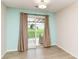Dining area with sliding glass doors leading to a patio and backyard at 8141 Maple Stream Ln, Indianapolis, IN 46217