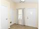 Bright entryway featuring wood-look floors, neutral walls, and two convenient interior doors at 8141 Maple Stream Ln, Indianapolis, IN 46217