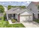 Charming single-story home featuring a two-car garage and inviting, landscaped front yard at 8141 Maple Stream Ln, Indianapolis, IN 46217