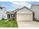 Attractive home with a spacious driveway and beautiful yard, perfect for suburban comfort at 8141 Maple Stream Ln, Indianapolis, IN 46217