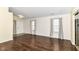 Inviting living room featuring hardwood floors, neutral walls, and large windows with natural light at 8141 Maple Stream Ln, Indianapolis, IN 46217
