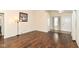 Spacious living room featuring gleaming hardwood floors, neutral walls, and abundant natural light at 8141 Maple Stream Ln, Indianapolis, IN 46217