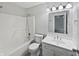 Well-lit bathroom featuring a shower-tub combination and a vanity with sink at 8146 Whitaker Valley Blvd, Indianapolis, IN 46237